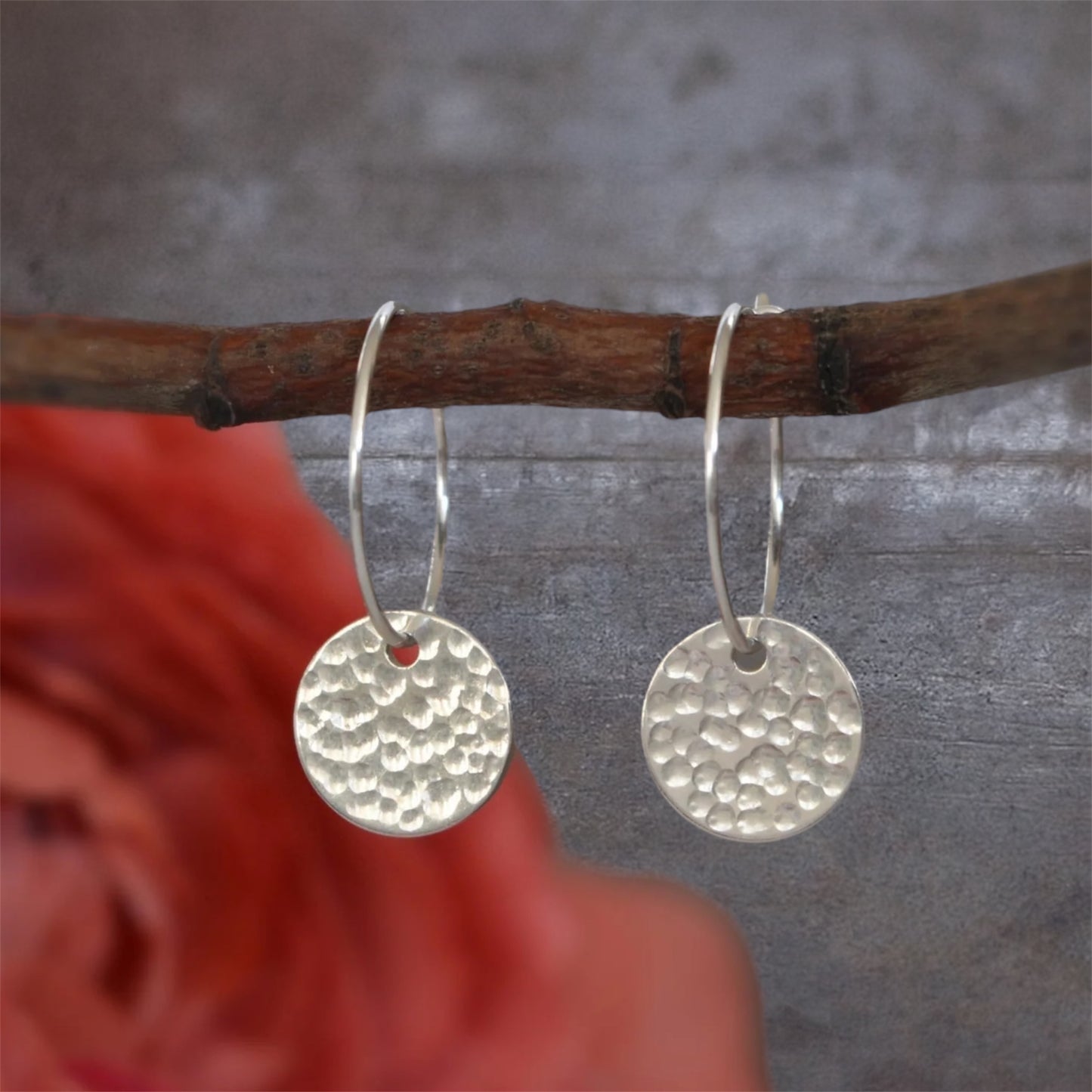 Sterling silver disc charm hoop earrings.