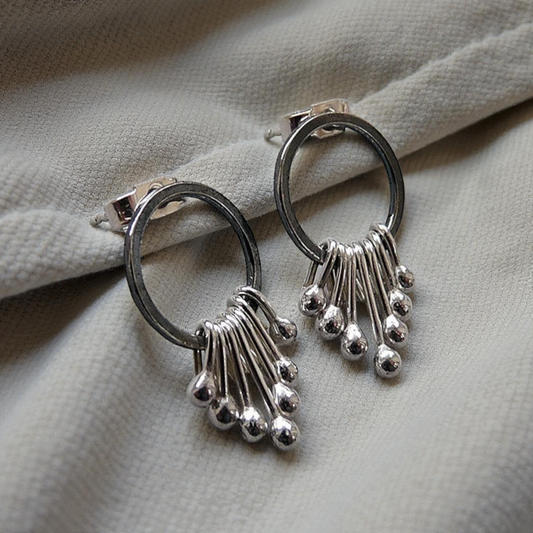 Sterling silver oxidised circle dangle studs.