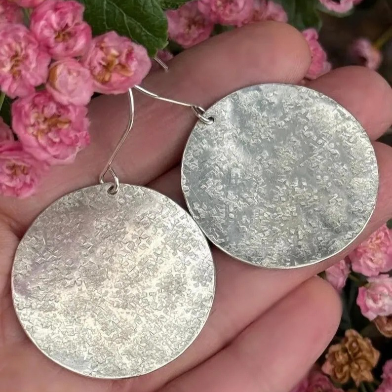 Handmade large sterling silver textured dangle disc earrings.