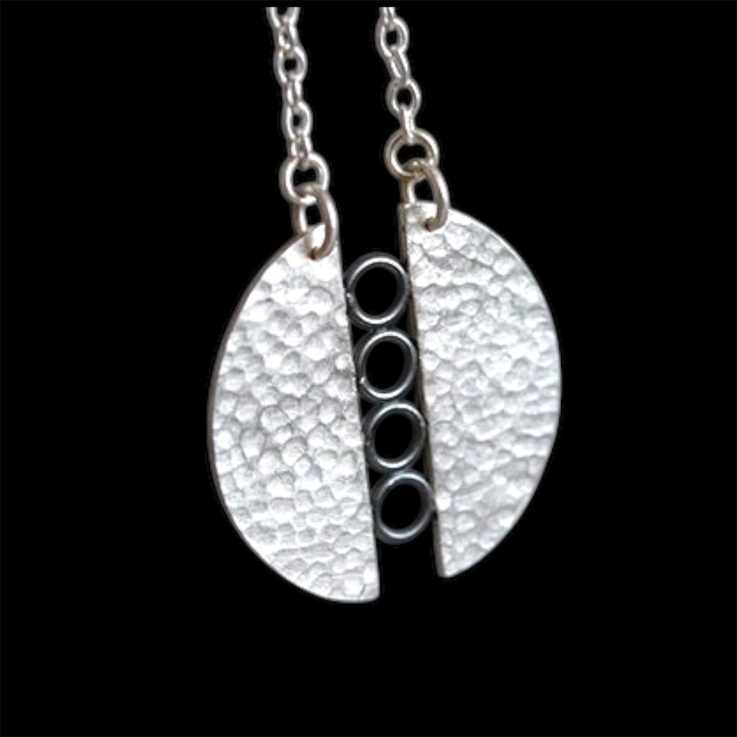 Sterling silver textured circle pendant necklace.