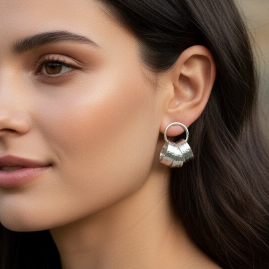 Sterling silver circle stud earrings.