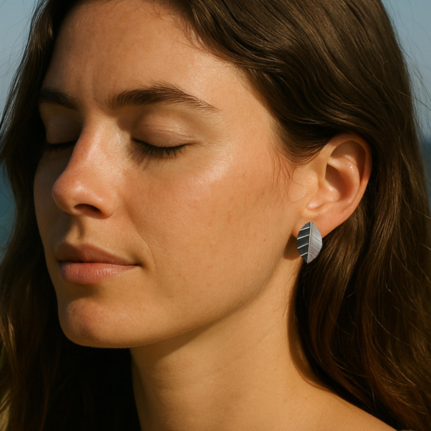 Sterling silver leaf stud earrings.