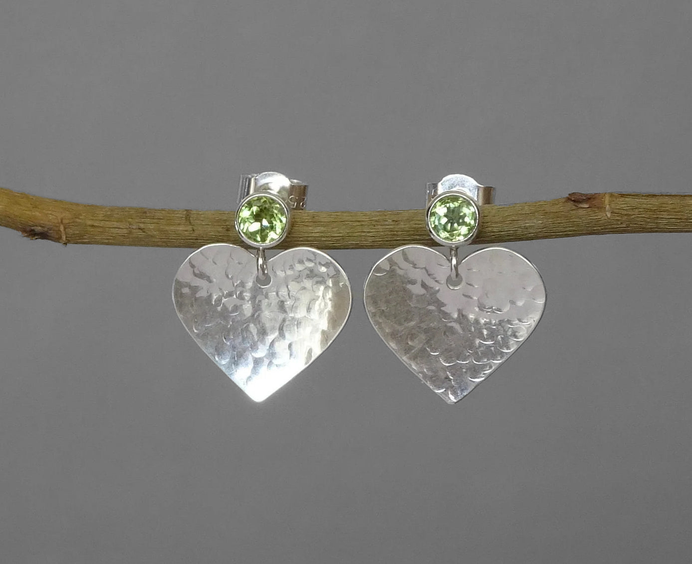 Peridot August birthstone sterling silver heart stud earrings.