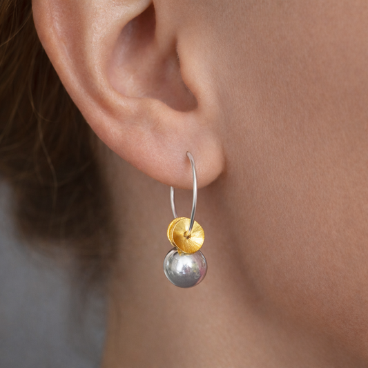 Sterling silver ball hoop earrings.