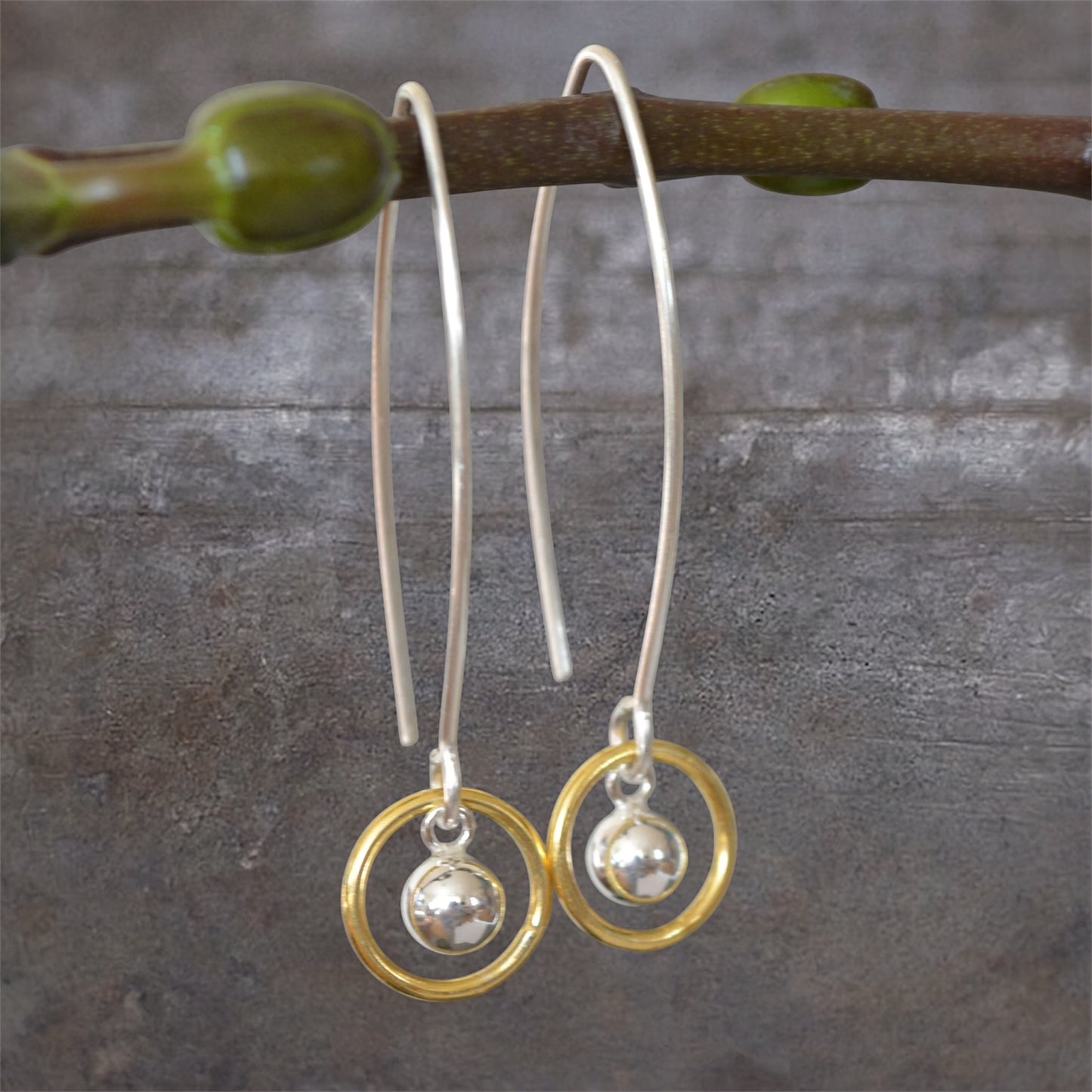 Ball and circle sterling silver and 24k gold vermeil dangle earrings.