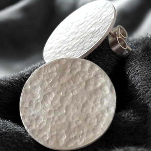 Minimalist sterling silver hammered disc stud earrings.