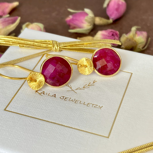Handmade ruby earrings in gold vermeil, elegant July birthstone jewellery on Kaila Jewellery gift packaging with ribbon.