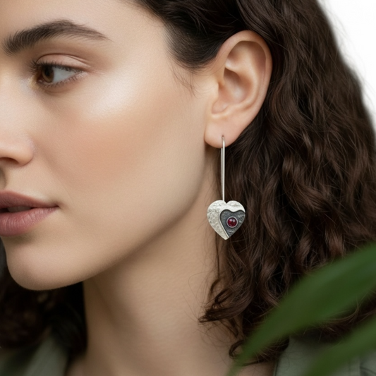 Garnet sterling silver heart earrings.
