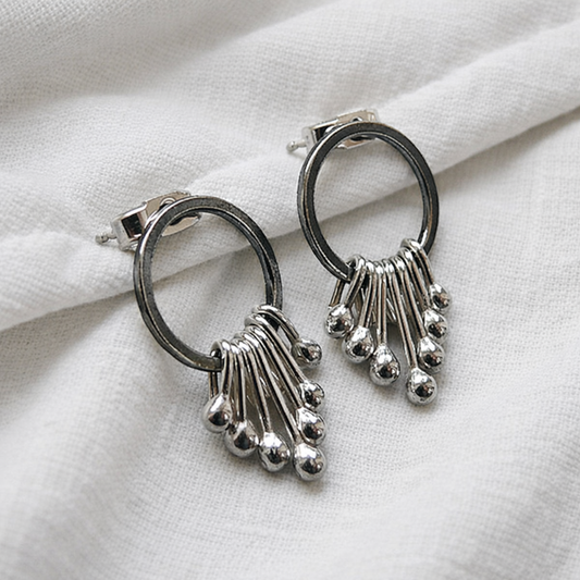 Sterling silver oxidised circle dangle studs.