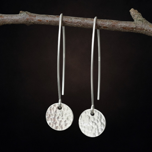 Hammerd sterling silver disc dangle earrings.