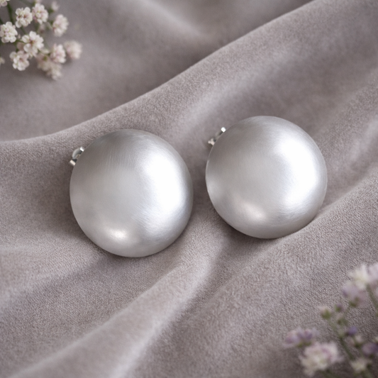 Large statement sterling silver bowl stud earrings.