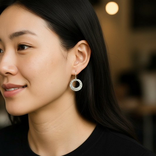 Hammered circle sterling silver earrings.