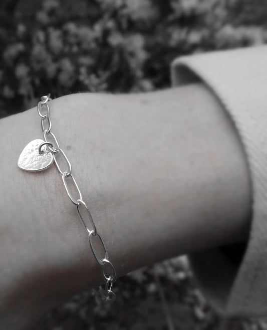 Sterling silver heart charm bracelet.