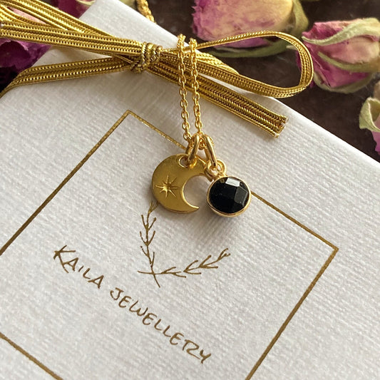 24k gold vermeil black onyx charm and crescent moon necklace. The charms are suspended from a 24k gold vermeil fine chain.