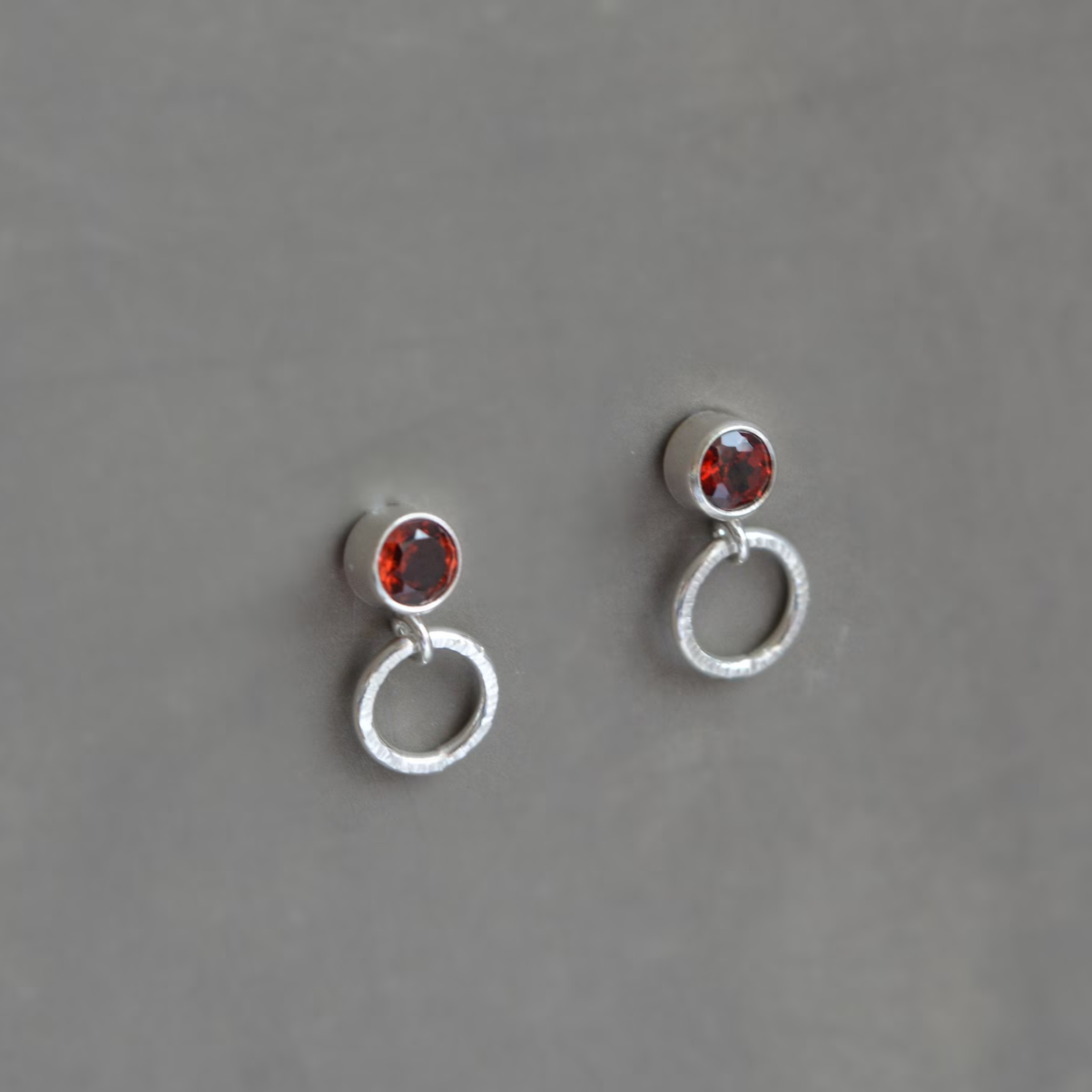 garnet sterling silver stud earrings with small circle
