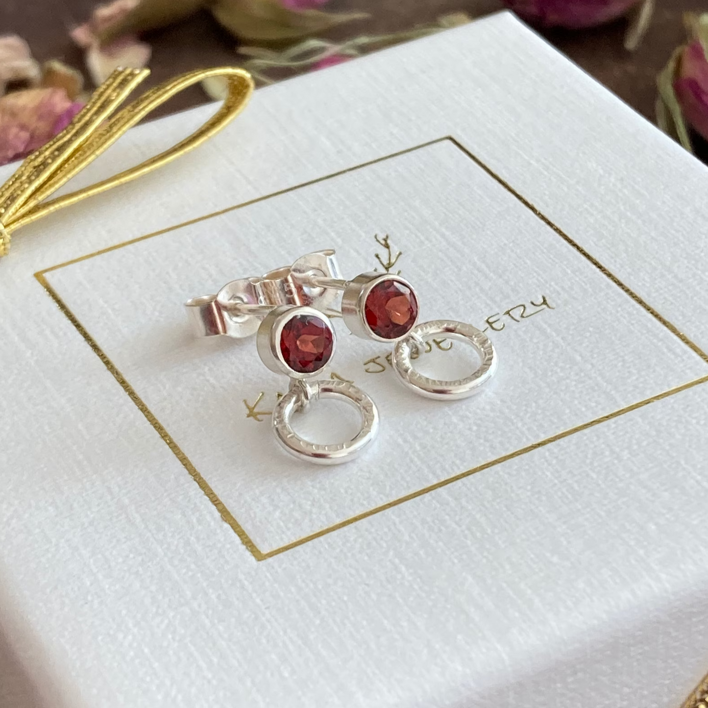 garnet sterling silver stud earrings with small circle