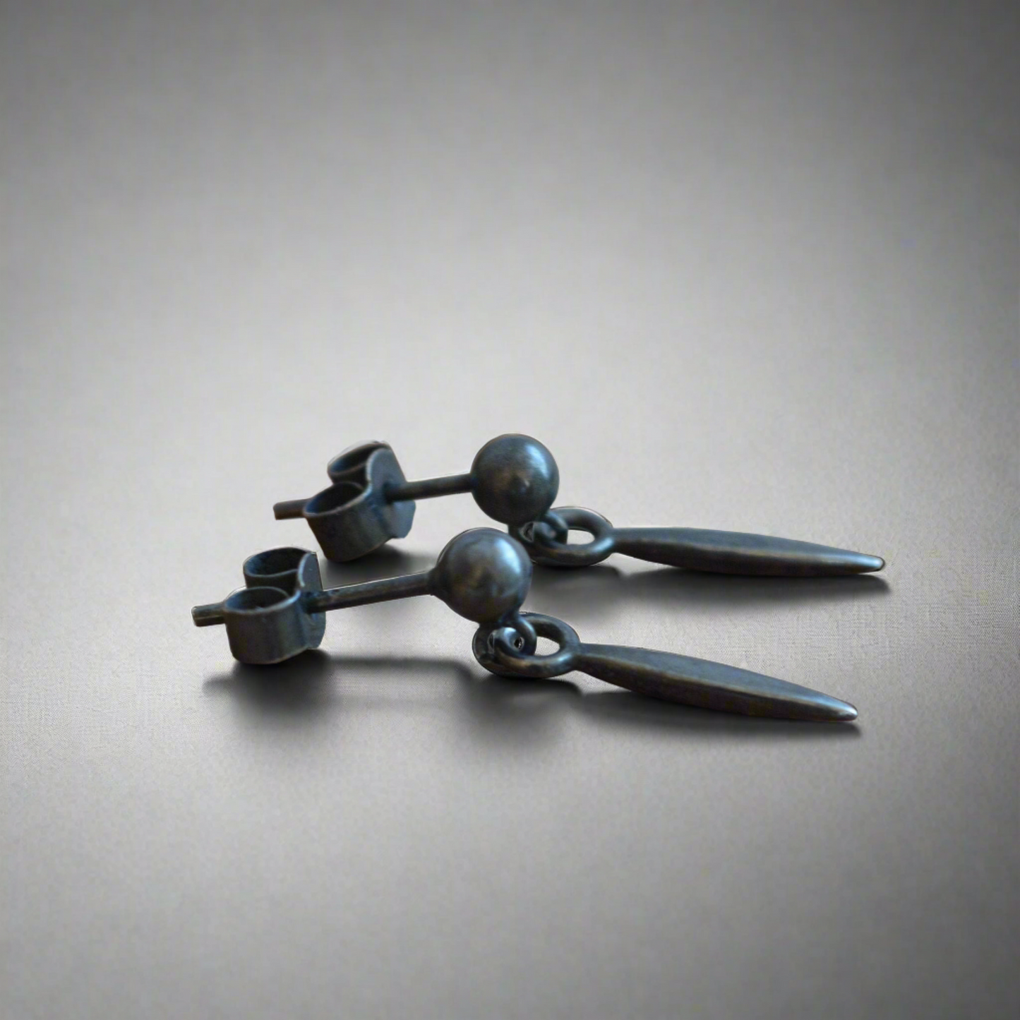 Oxidised sterling silver ball and spear stud earrings.