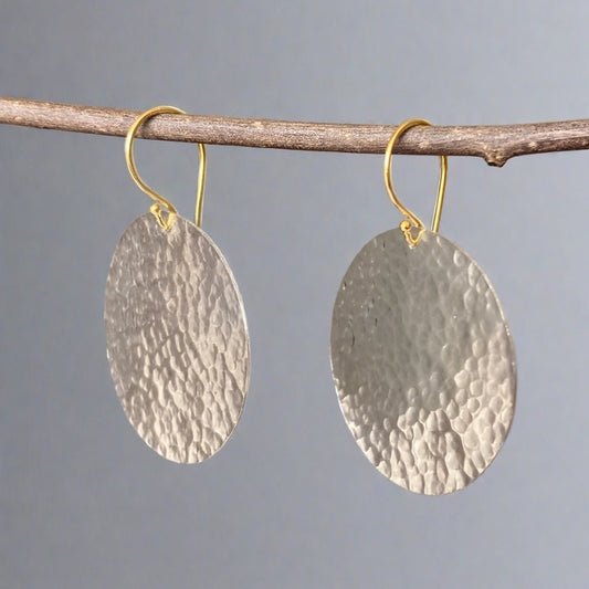 large silver textured disc and gold ear wires earrings