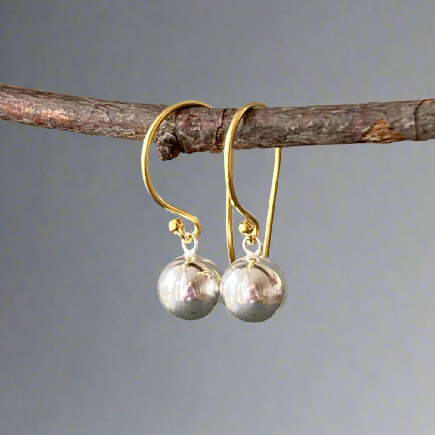 Gold and silver ball dangle earrings