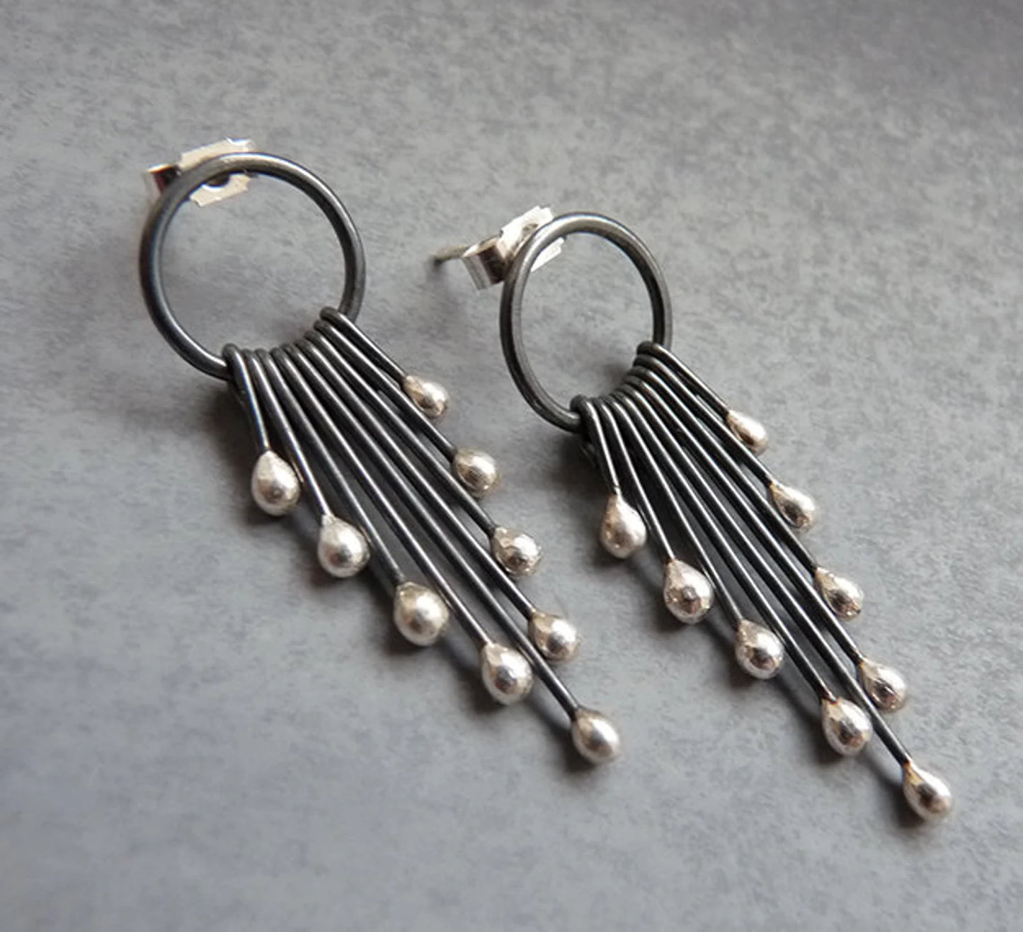 Sterling silver oxidised circle and droplets stud earrings.