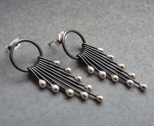 Sterling silver oxidised circle and droplets stud earrings.