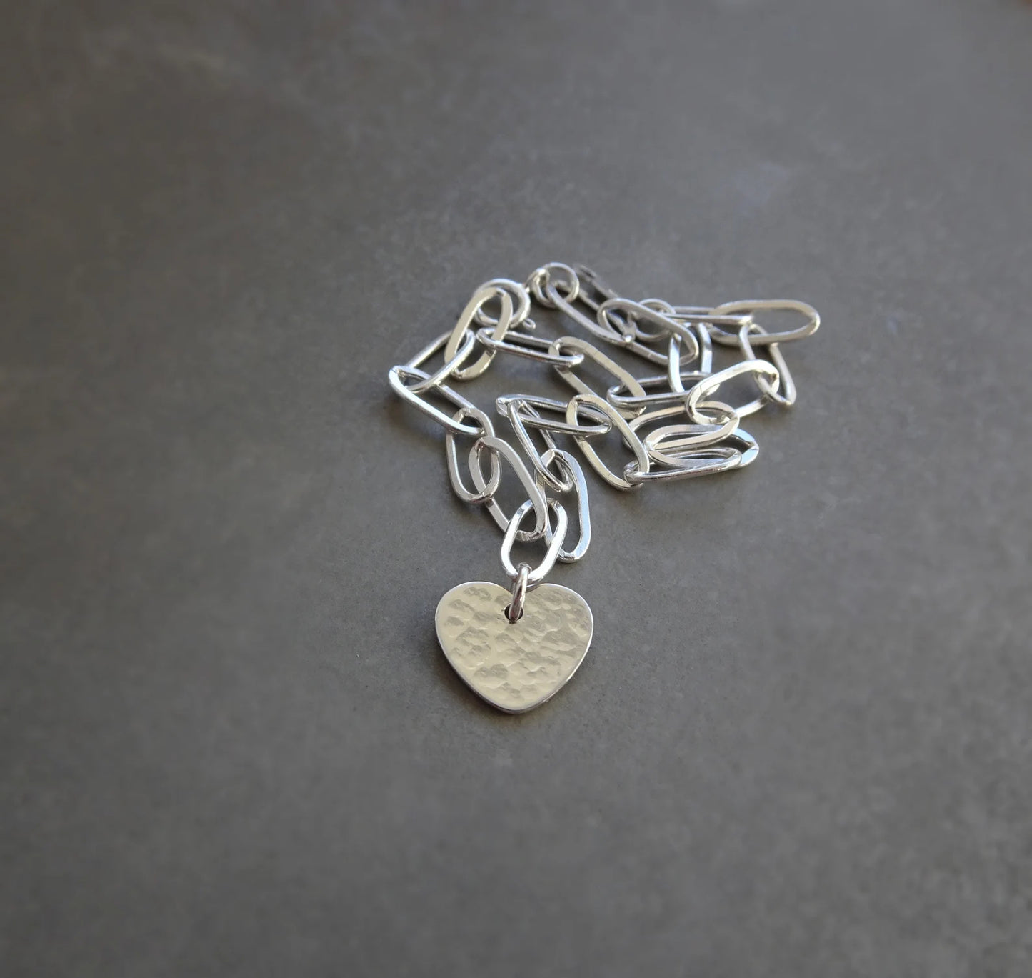 Sterling silver disc charm cable chain bracelet.