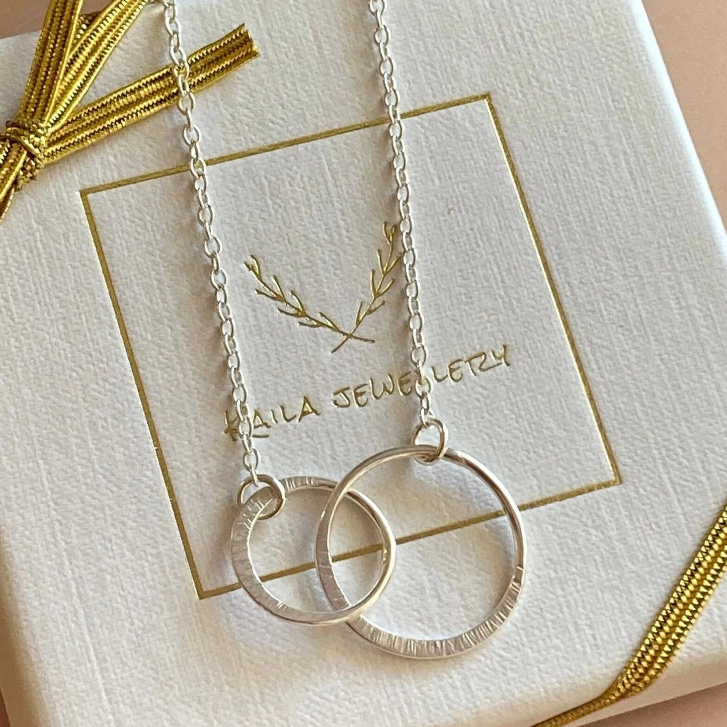 Sterling silver infinity necklace.