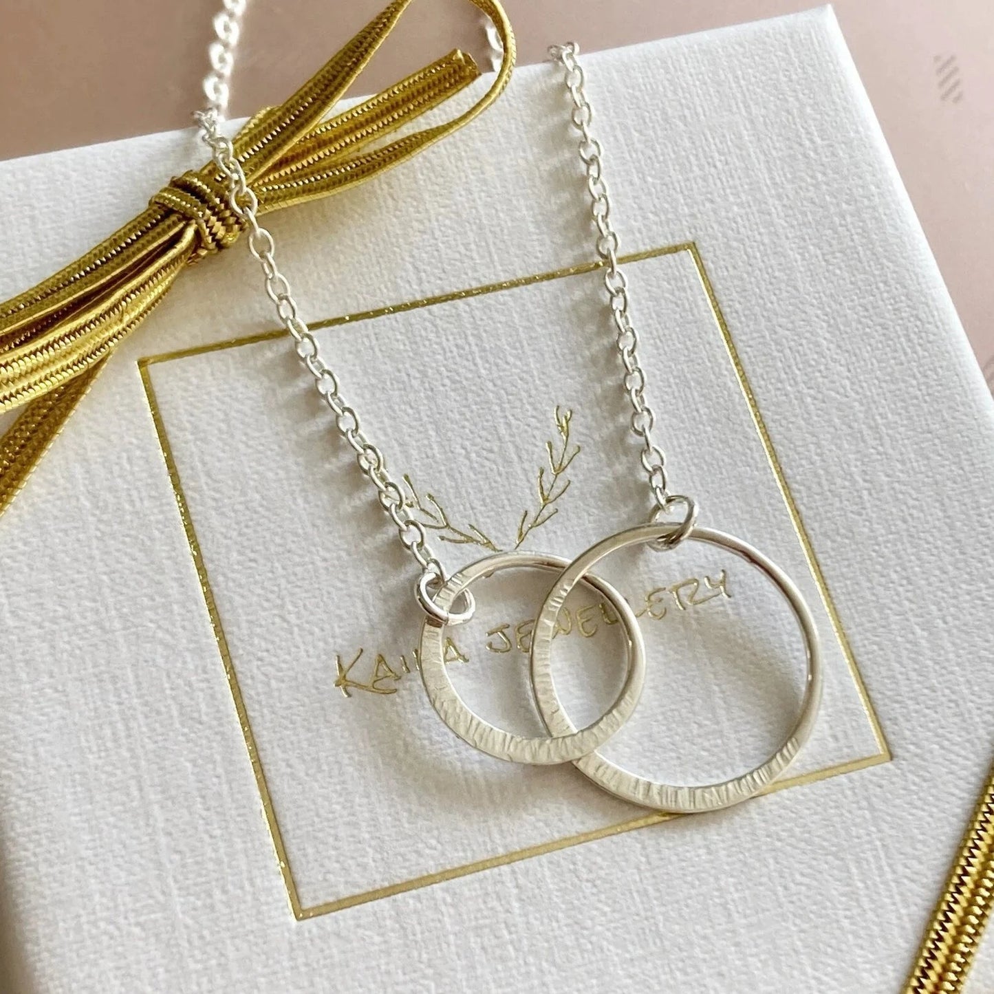 Sterling silver infinity necklace.