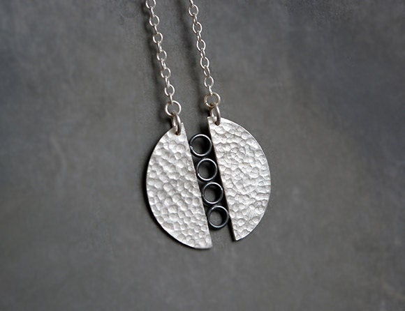 Sterling silver textured circle pendant necklace.