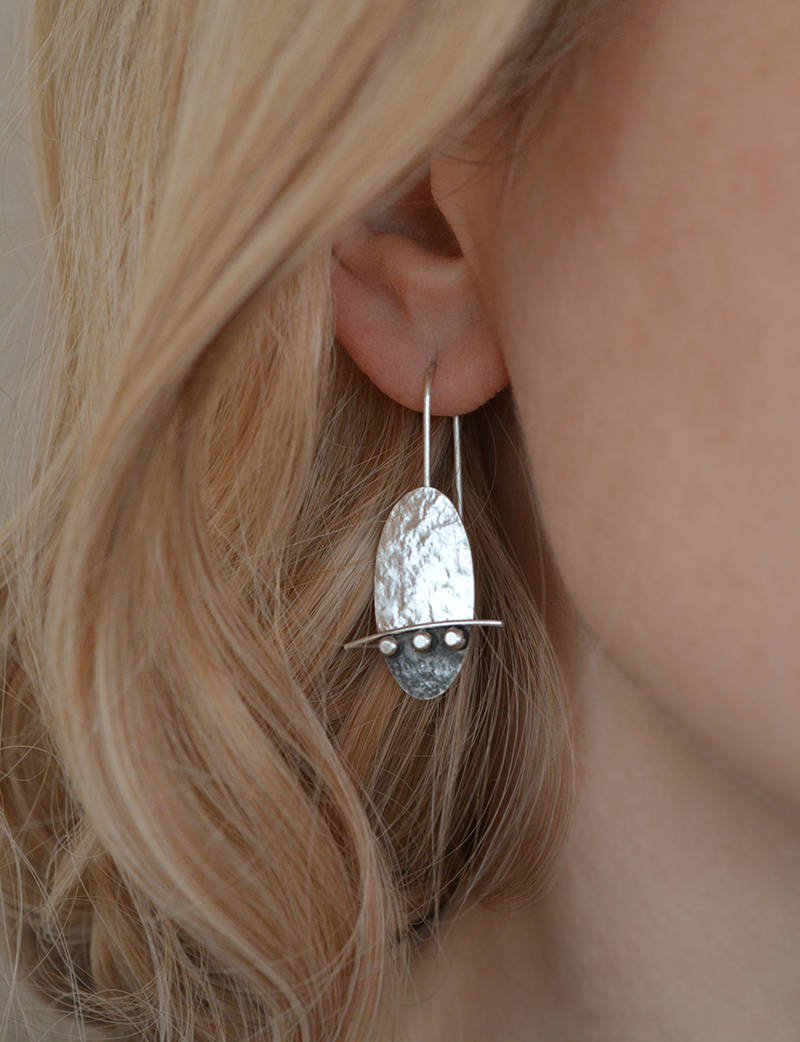 Artisan oval sterling silver drop earrings.