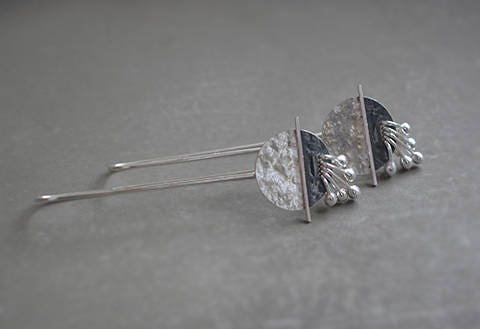 Long sterling silver drop earrings.