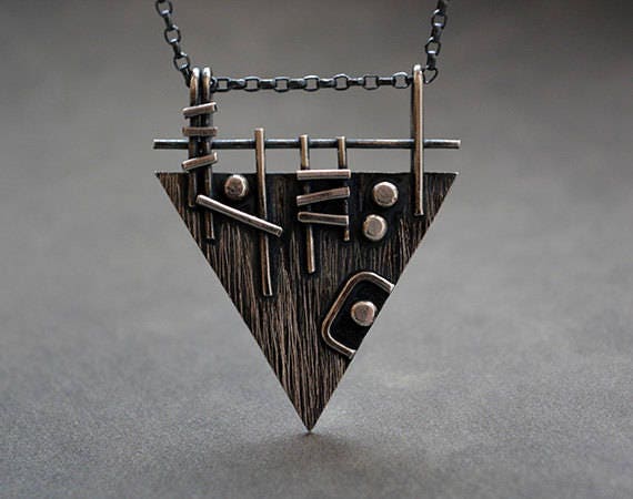 Sterling silver triangle necklace.
