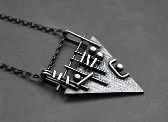 Sterling silver triangle necklace.