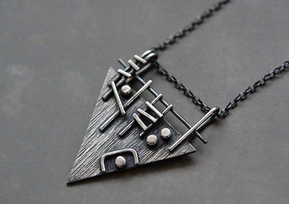 Sterling silver triangle necklace.