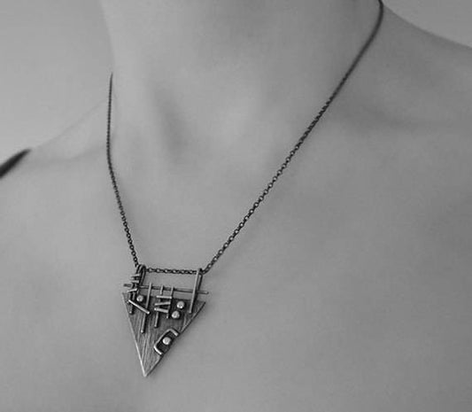 Sterling silver triangle necklace.