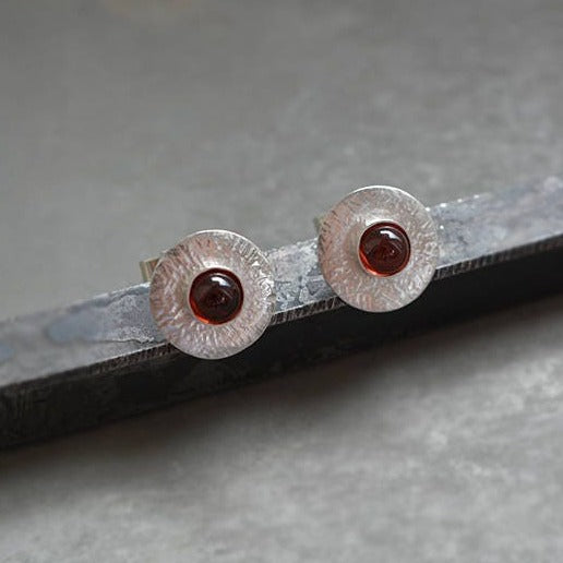 Garnet sterling silver disc stud earrings.