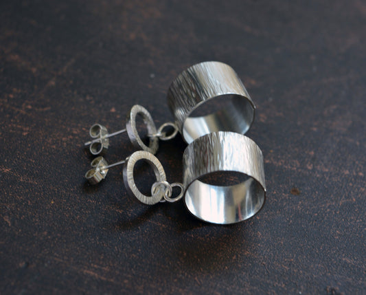 Sterling silver hammered circle stud earrings.