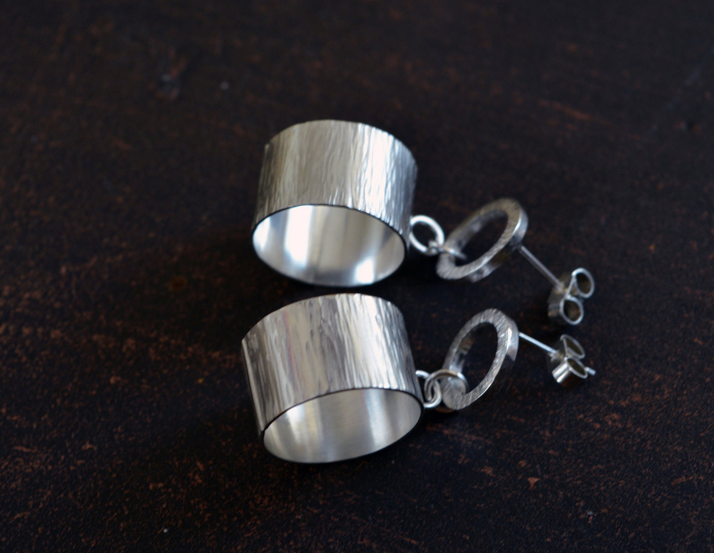 Sterling silver hammered circle stud earrings.