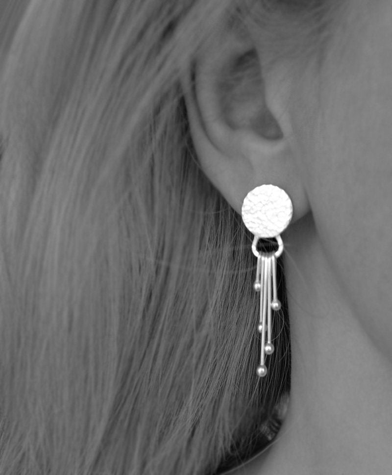 Sterling silver dangle textured disc earrings.