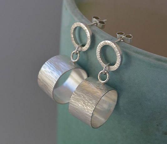 Sterling silver circle stud earrings.