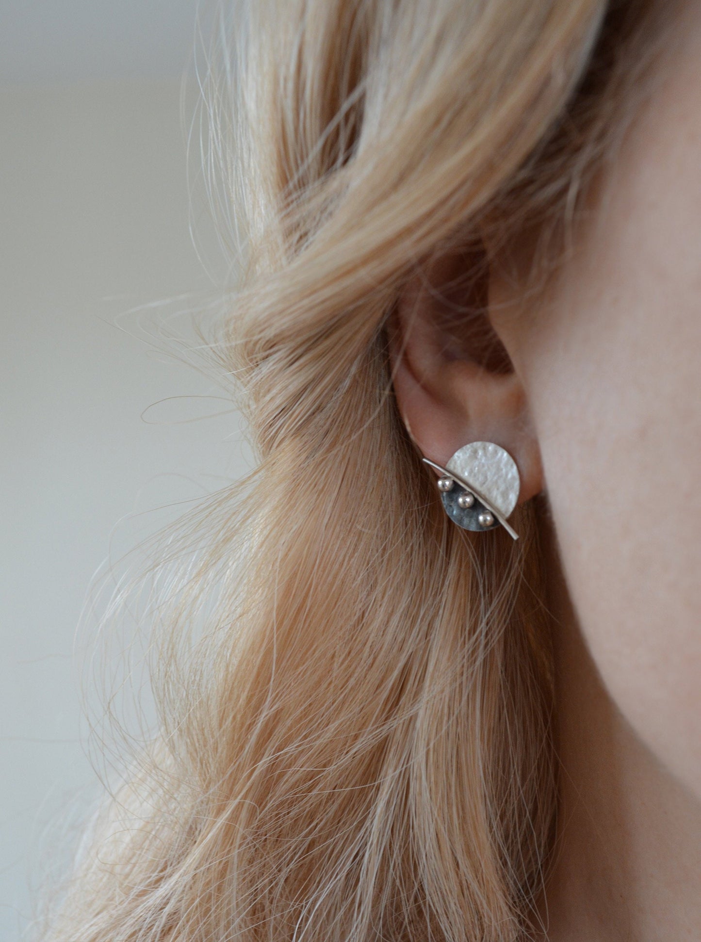 Sterling silver disc stud earrings.