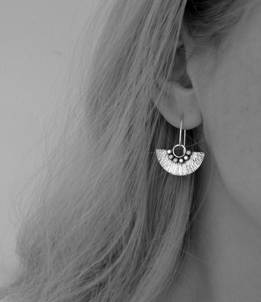 Sterling silver dangle fan earrings.