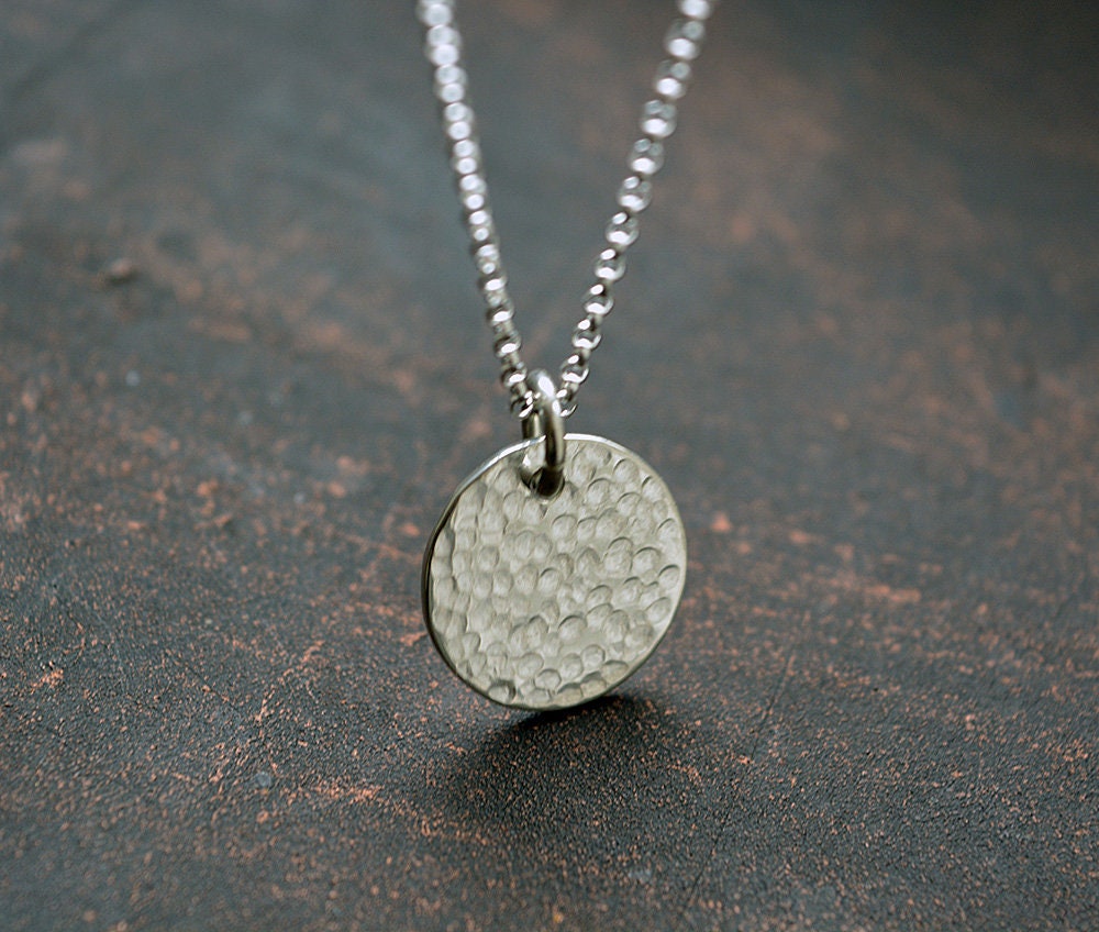Minimalist sterling silver textured disc necklace.