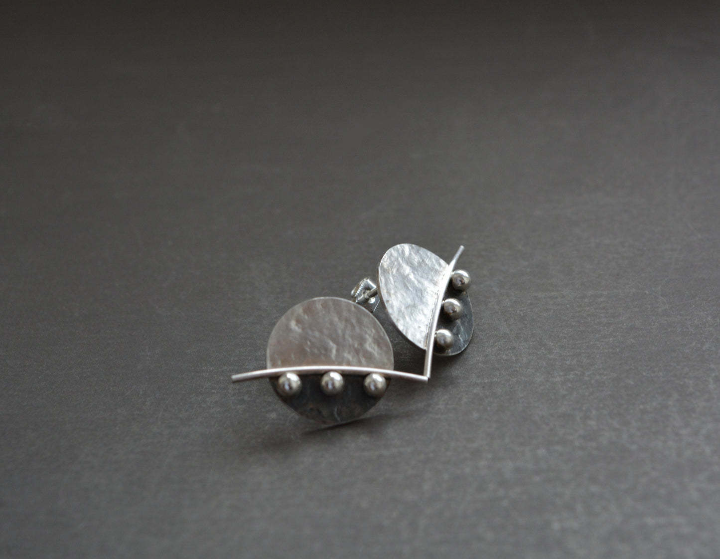 Sterling silver disc stud earrings.