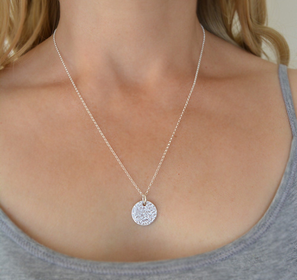 Minimalist sterling silver textured disc necklace.