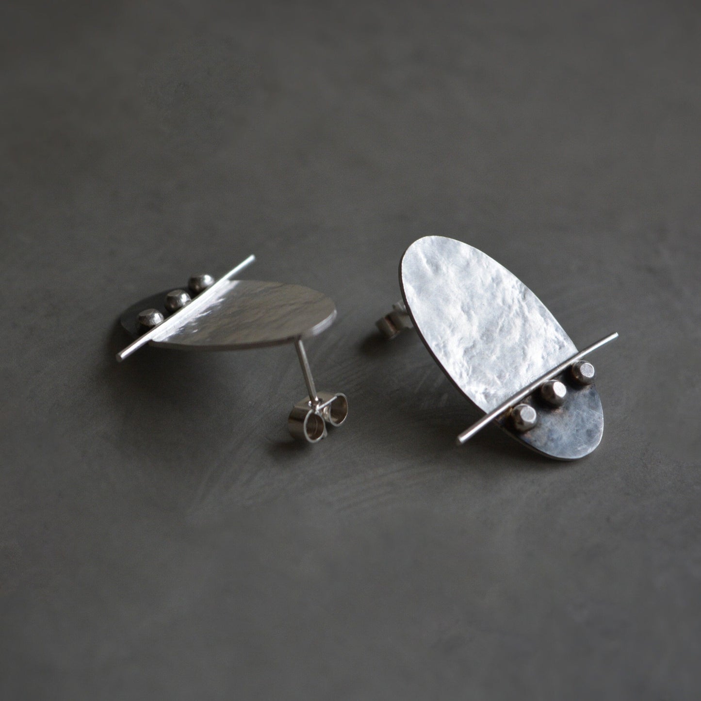 Sterling silver oval textured stud earrings. Oxidised earrings.