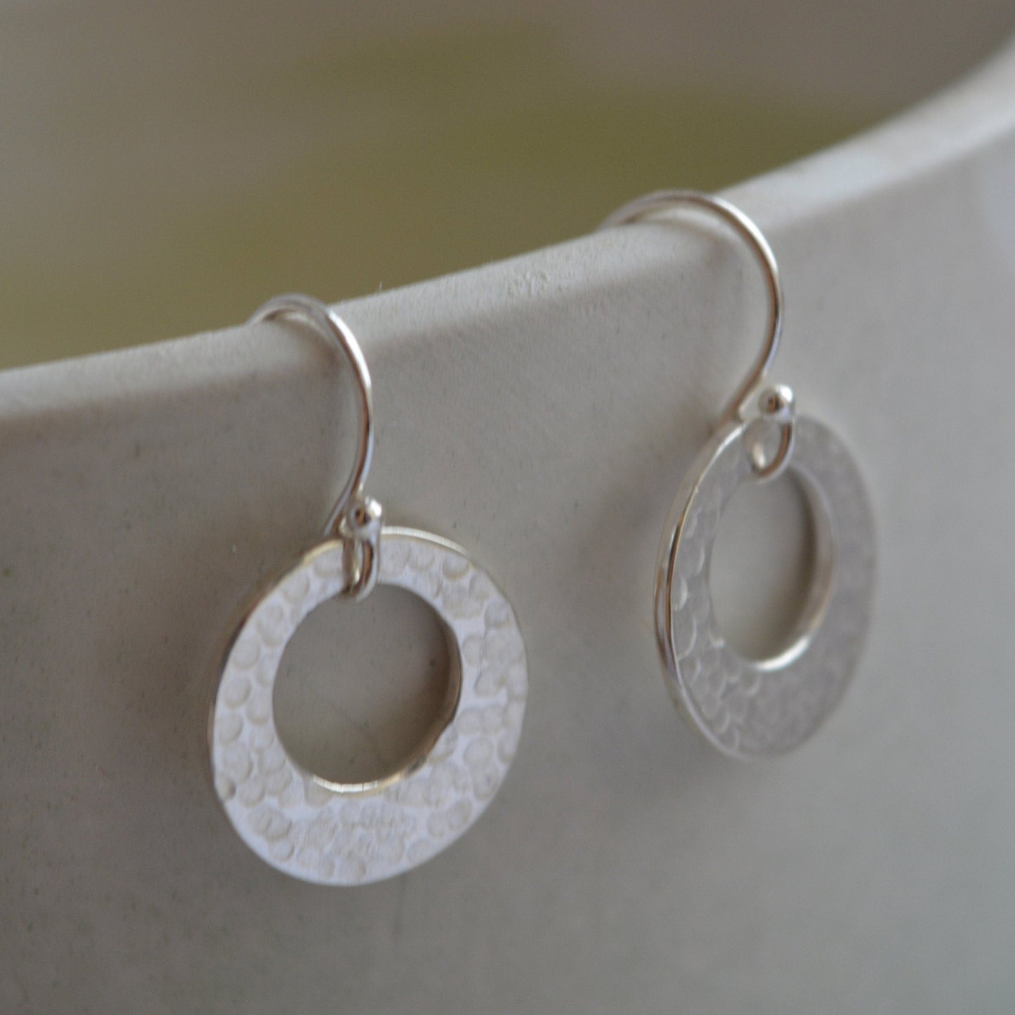 Hammered circle sterling silver earrings.