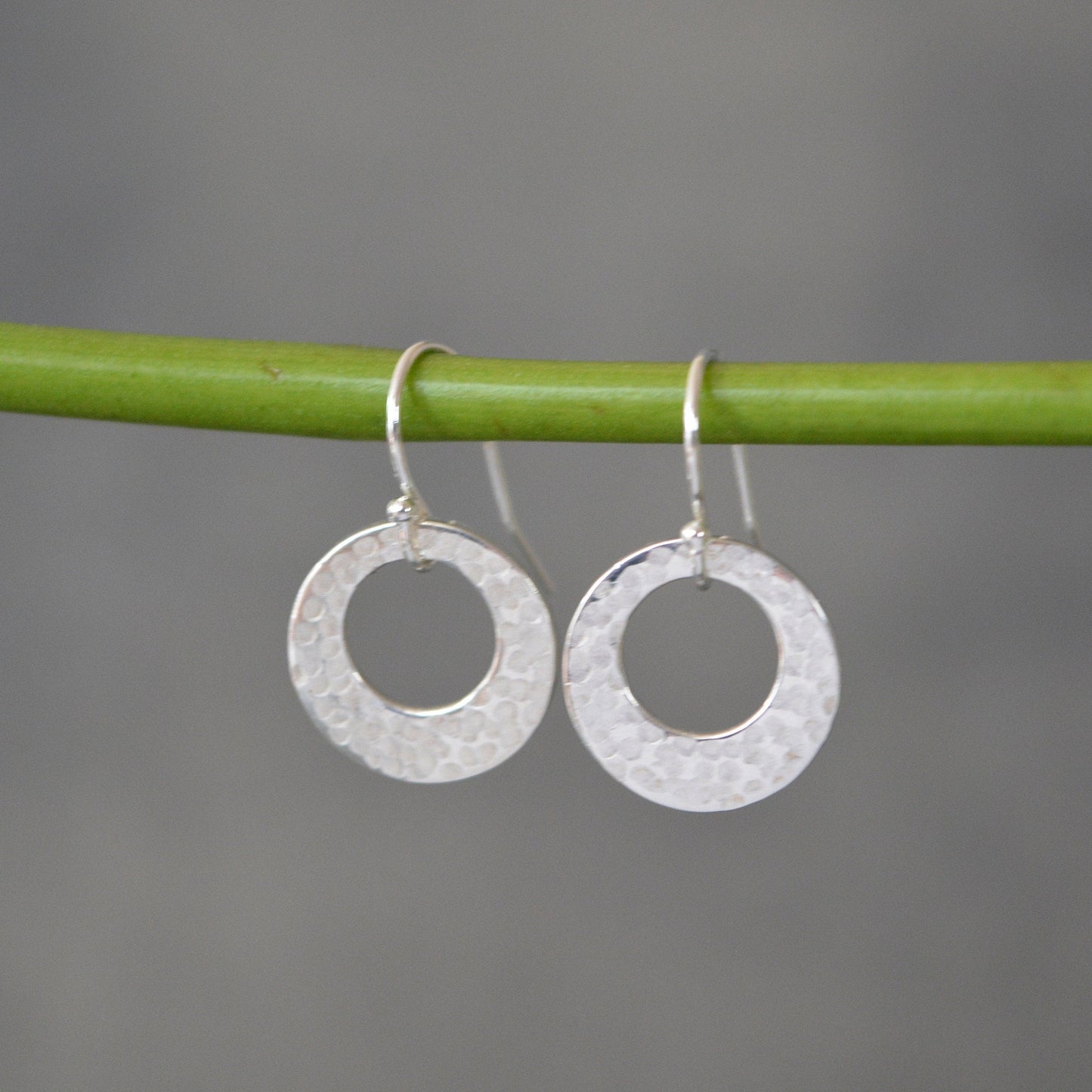Hammered circle sterling silver earrings.