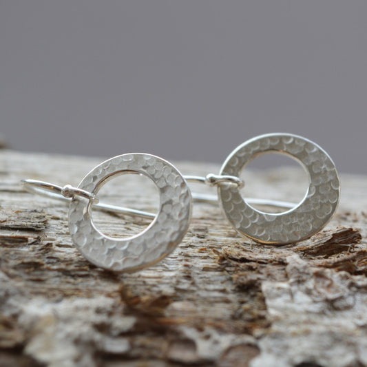 Hammered circle sterling silver earrings.