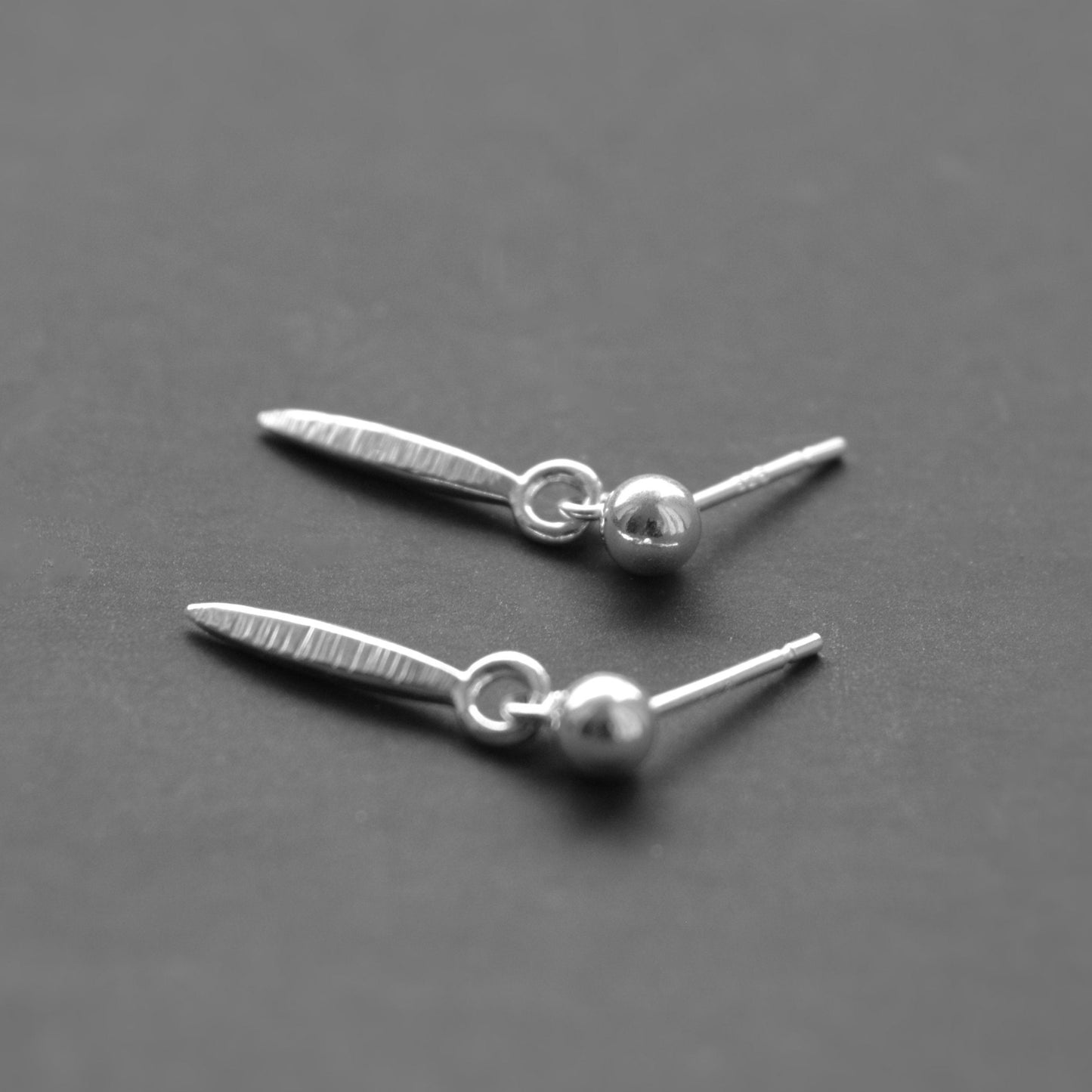 sterling silver ball and textured spear stud earrings